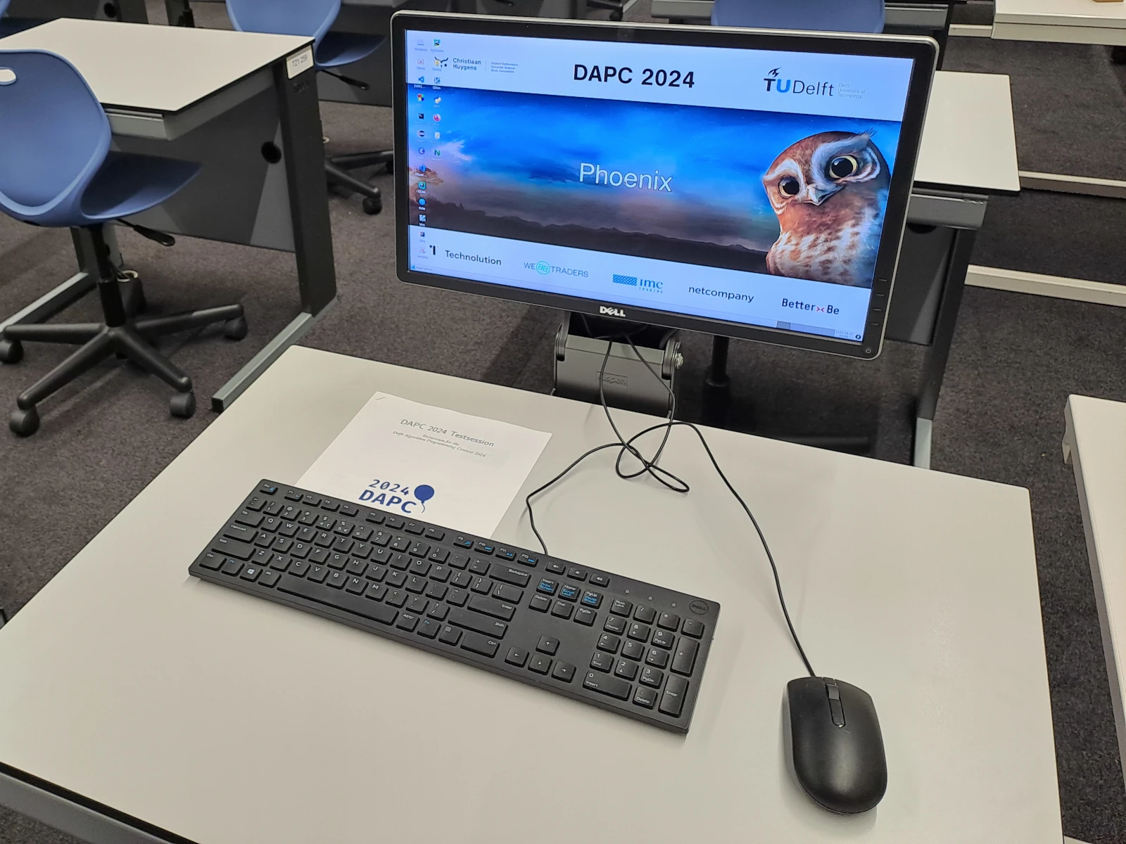 A picture of the workspace available to each BAPC 2025 team. Picture taken during the Delft Algorithm Programming Contest (DAPC) 2024.